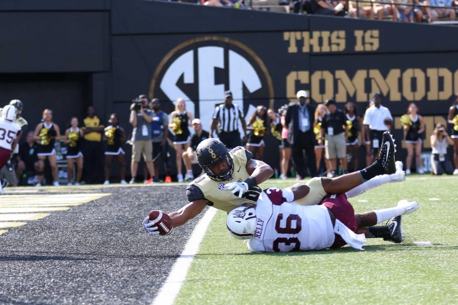 Jared Pinkney reaches across the goal line for a touchdown in Vanderbilt's home victory over Alabama A&M on September 9, 2017. Photo by Claire Barnett. 