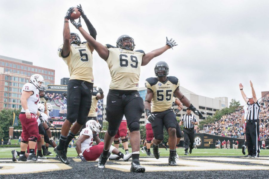 Adam Butler (69)  scores on a fumble recovery during Vanderbilt's game against UMass September 13, 2014 at Vanderbilt Stadium Nashville, TN. Vanderbilt won its first game of the season 34-31. Photo by Ziyi Liu. 