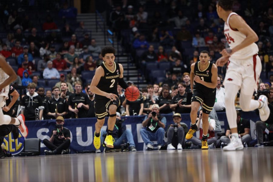 Scotty Pippen Jr. (2) pushes the ball up the court as Dylan Disu (1) trails in Vanderbilt's loss to Arkansas. 