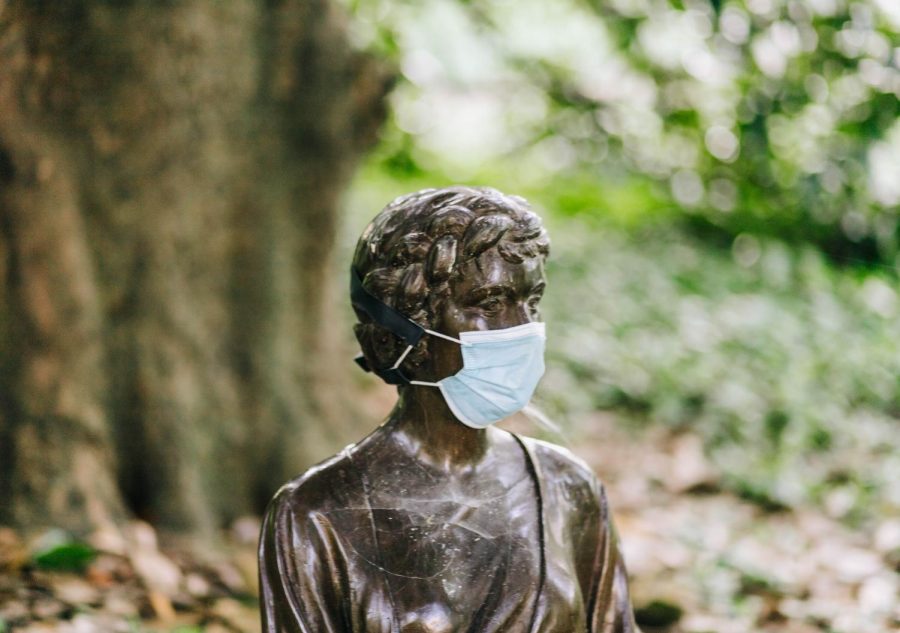 Statue wearing mask