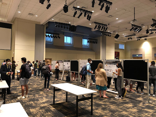 students and professors mingle at in the ballroom