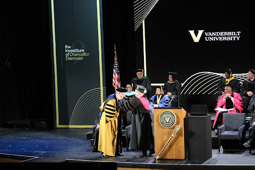 Board of Trust chairman Bruce R. Evans presents Chancellor Daniel Diermeier with the chancellor’s chain of office during Diermeier’s investiture ceremony, as photographed on April 9, 2022. (Hustler Staff/Katherine Oung)
