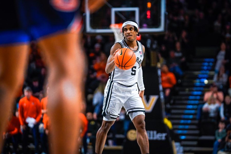Ezra Manjon dribbles during a 67-65 win over Auburn on Feb. 18, 2023 (Hustler Multimedia/Nikita Rohila).