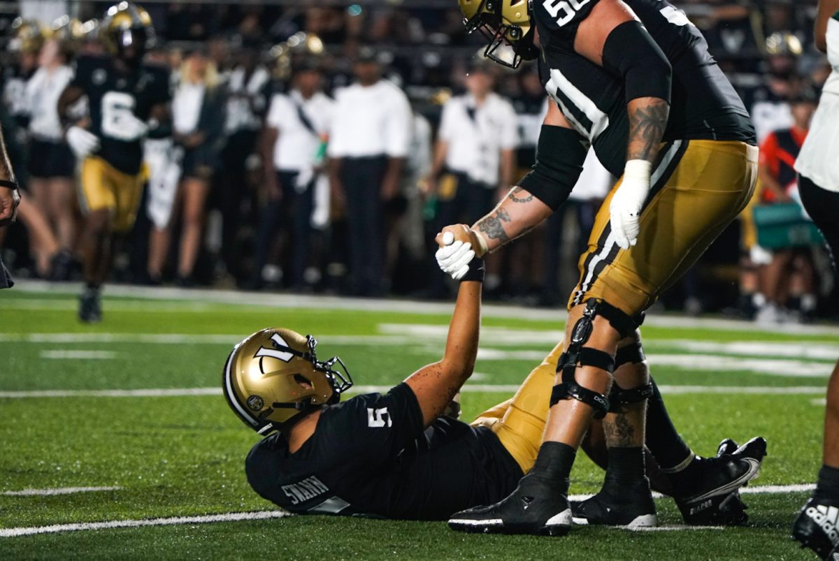 AJ Swann lifted up by Bradley Ashmore against the Hawai'i Rainbow Warriors, as photographed on Aug. 26, 2023. (Hustler Multimedia/Nikita Rohila)