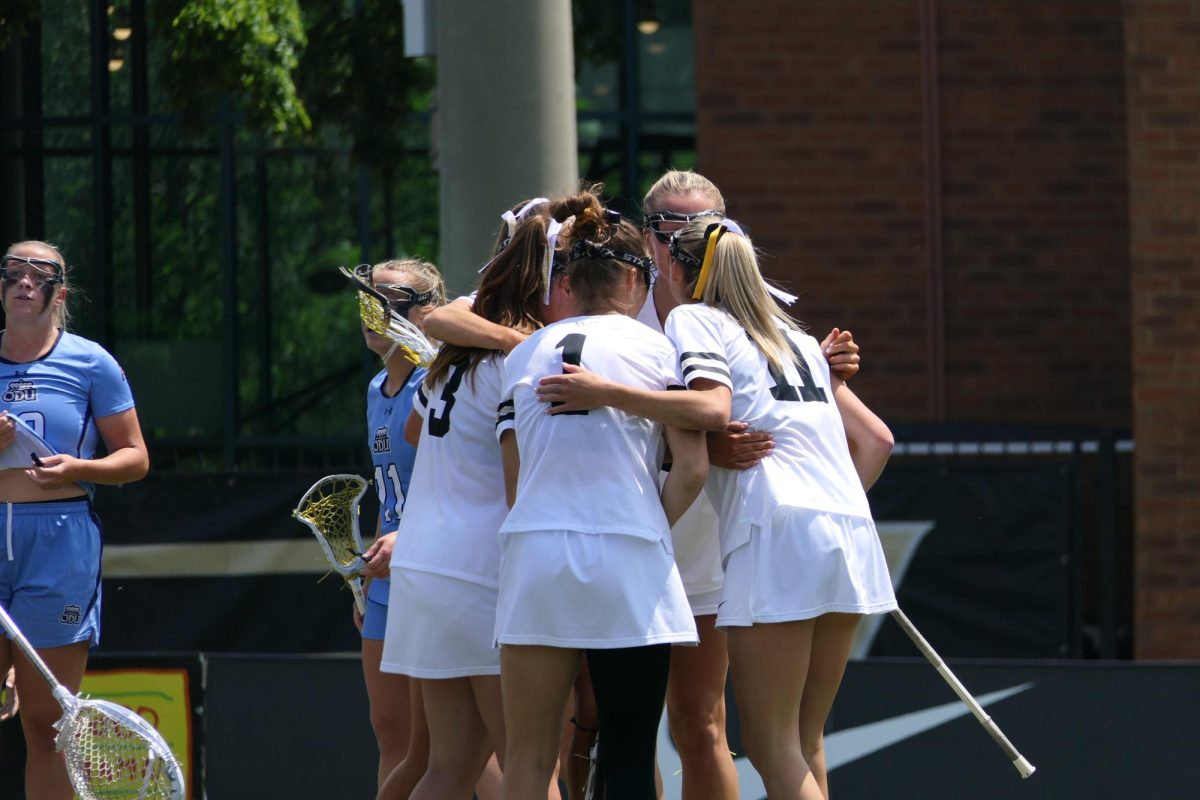 Vanderbilt's lacrosse players huddle up during their match against Old Dominion, as photographed on April 26, 2025. (Hustler Multimedia/Alex Brodeur)