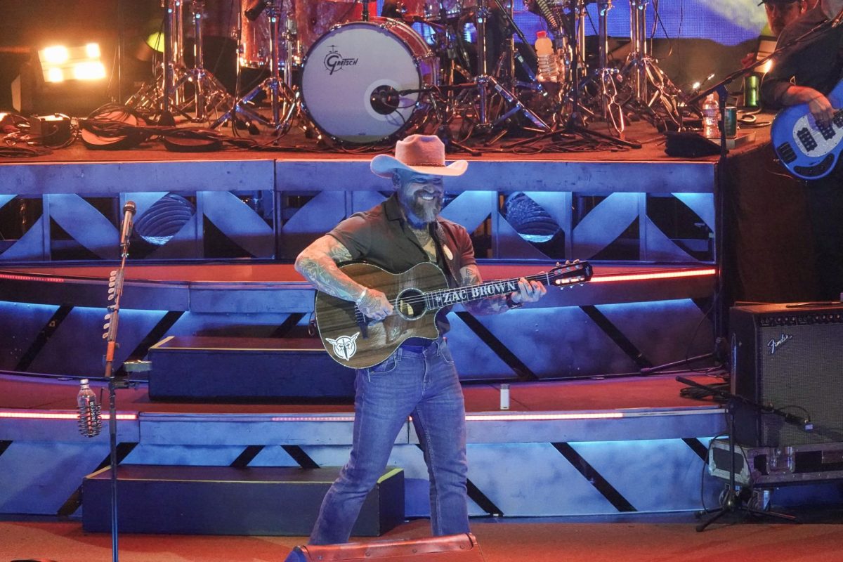 Zac Brown smiles at the crowd as he plays guitar, as photographed on April 2, 2025. (Hustler Multimedia/Lana English)