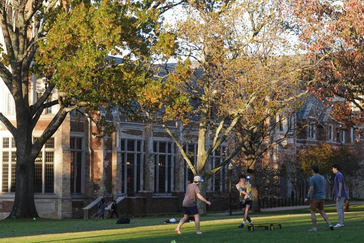 Four students playing Spikeball outside of EBI in the fall, as photographed on Nov. 20, 2024. (Hustler Multimedia/Izabela Bisiak)