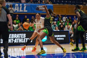 Khamil Pierre dribbles around an Oregon defender in the NCAA Tournament, as photographed on March 21, 2025. (Connor Campbell)